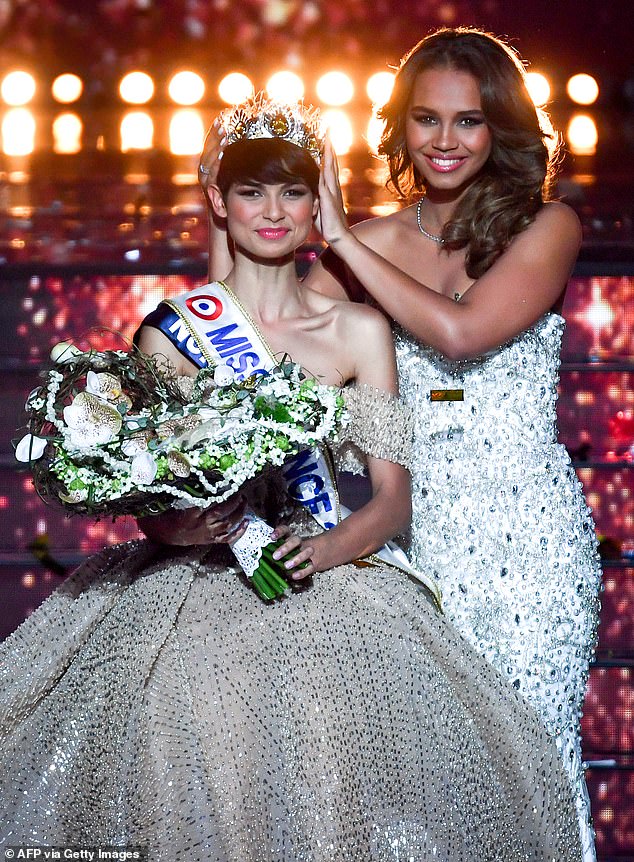 Eve Gilles (left), pictured being crowned Miss France 2024 by Miss France 2023 Indira Ampiot (right), during the Miss France 2024 beauty pageant in Dijon