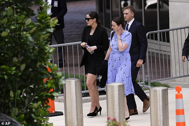 Naomi Biden (left) leaves the court on Friday with husband Peter Neal (right).  The young couple heads to the G7 with President Joe Biden and Naomi's sisters Finnegan and Maisy, following their father's federal gun conviction