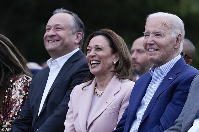 President Joe Biden listens with Vice President Kamala Harris and Second Gen. Doug Emhoff during a Juneteenth concert on the South Lawn of the White House