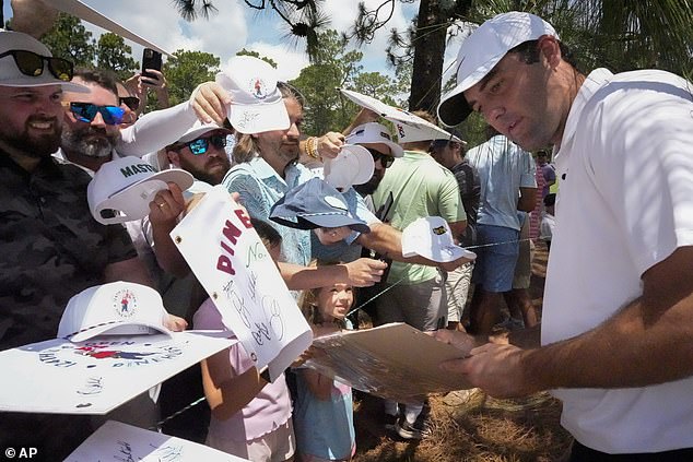 World No. 1 Scottie Scheffler signs autographs for supporters at Pinehurst No. 2 on Tuesday