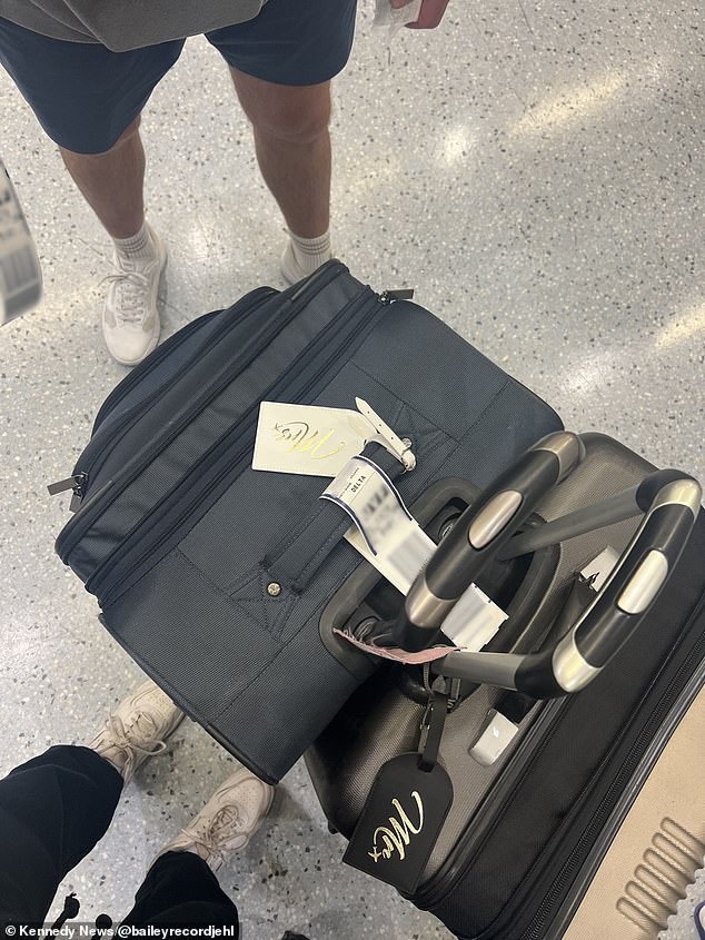 The photo shows the couple's luggage prior to their trip, with matching Mr. and Mrs. luggage tags for the newlyweds