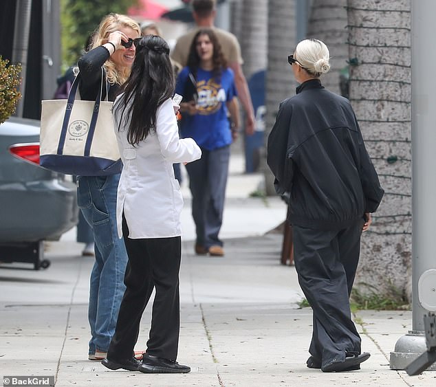 She mingled outside the office before heading to her car