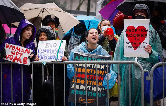 Pro-choice activists hold signs during the annual anti-abortion rally in New York City, March 23, 2024. The Biden campaign plans to delve heavily into the issue of abortion rights in a contest that will see Biden motivating his base supporters to amid bad polls.  against Donald Trump