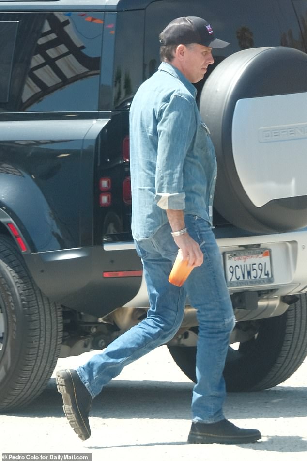 Hunter could be seen dressed in an all-denim outfit while carrying his fruit smoothie