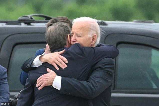 Joe Biden hugged his son Hunter Biden as he arrived in Delaware following the younger Biden's conviction on a gun crime