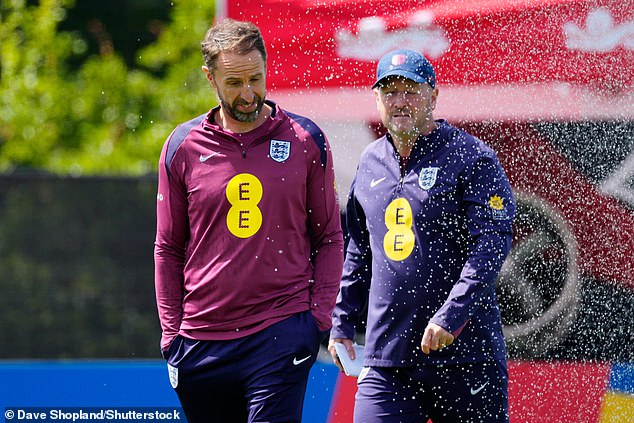 Gareth Southgate was cooled by a sprinkler as the sun beat down on the team