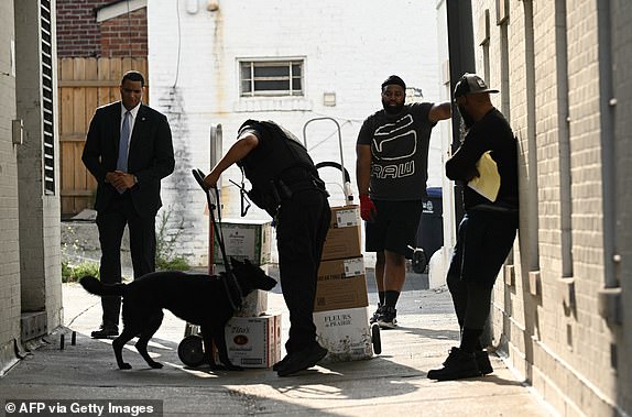 A K-9 police officer conducts a security sweep before former U.S. President and Republican presidential candidate Donald Trump meets with House and Senate Republicans on Capitol Hill in Washington, DC, on June 12, 2024.  (Photo by Brendan SMIALOWSKI/AFP) (Photo by BRENDAN SMIALOWSKI/AFP via Getty Images)