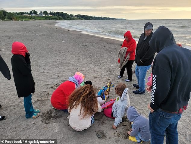 Others stayed with Chambers on the beach all night, hoping his son would return from the lake