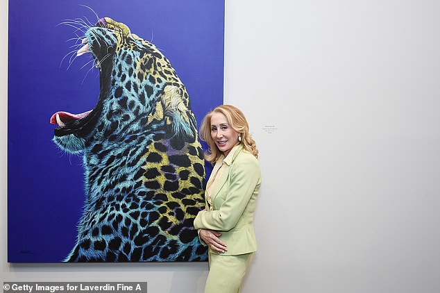 Grace went back to Koller's website to look for similar paintings and found an acrylic on canvas painting called Leopard in Teal & Yellow, which is worth $140,000.