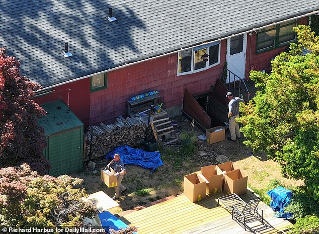 Search crews remove items from the basement of Rex Heuermann's home