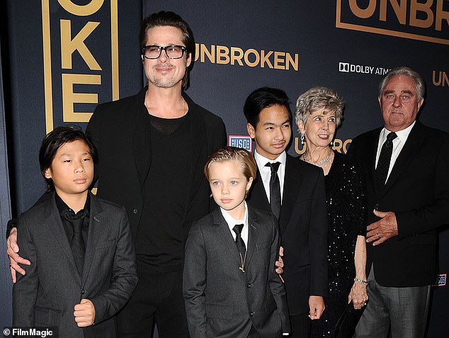 Pitt (pictured with three of his children and his parents in 2014) shares four daughters and two sons with his ex-wife
