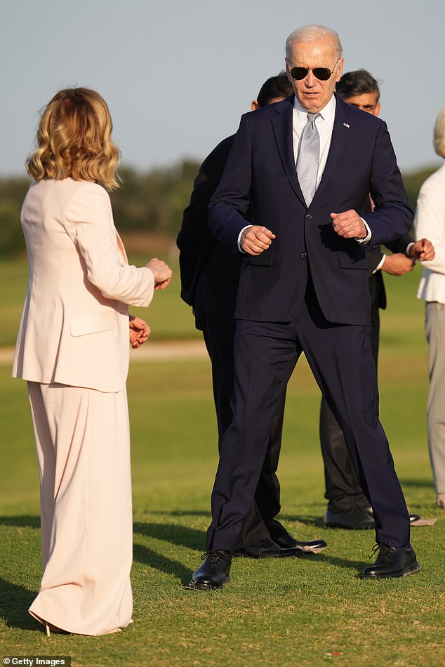 US President Joe Biden joins G7 leaders as they gather to watch a skydive at San Domenico Golf Club during the first day of the 50th G7 Summit on June 13, 2024