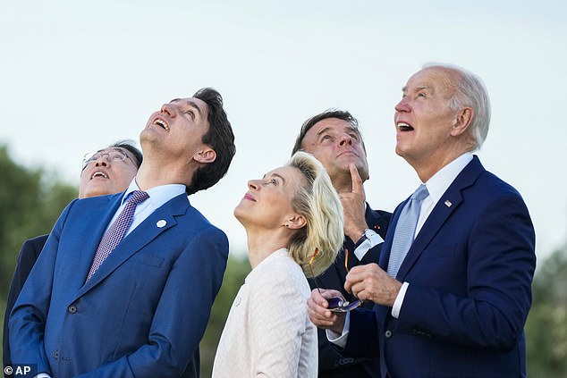 From right, US President Joe Biden, French President Emmanuel Macron, European Commission President Ursula von der Leyen, Canadian Prime Minister Justin Trudeau and Japanese Prime Minister Fumio Kishida watch a skydiving demo during the G7 world leaders' summit in Borgo Egnazia, Italy, Thursday.  June 13, 2024