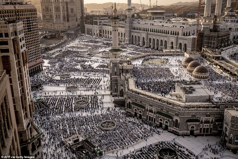 Muslim worshipers walk near the Grand Mosque in Saudi Arabia's holy city of Mecca