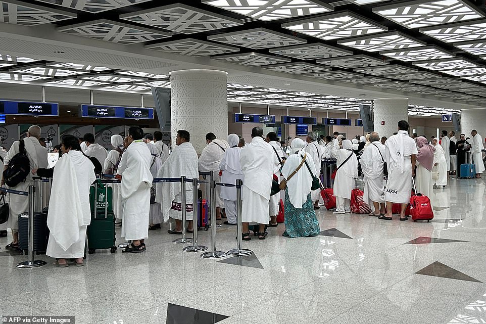 Muslim pilgrims wait for immigration after arriving for the annual Muslim pilgrimage in Mecca, at Jeddah International Airport