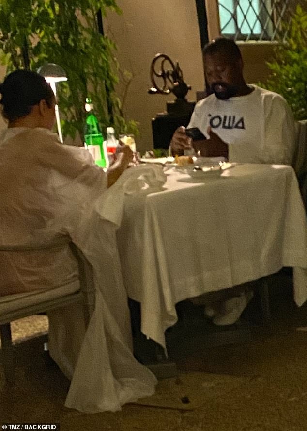 Meanwhile, West wore a casual, covered-up side-by-side outfit, wearing a white long-sleeved top, pants and sneakers.