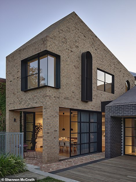 Designers embraced brickwork as a feature of both the interior and exterior of Mygunyah By The Circus, using different shades, patterns and textures that combine with unusual angles and arched windows to create a playful rear facade