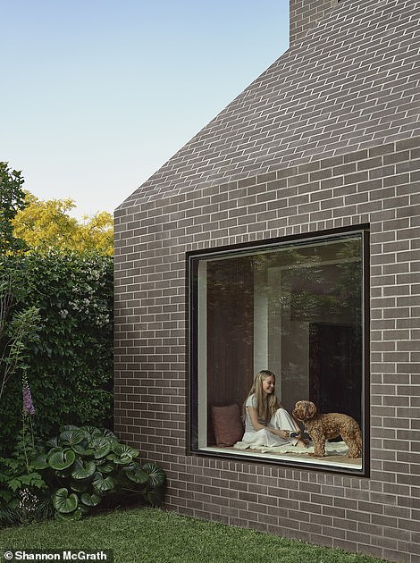 The new owners have removed the gray paint that covered the stone street side of the terrace and added a contemporary extension with design elements that reflect the original house to maintain its picturesque character.