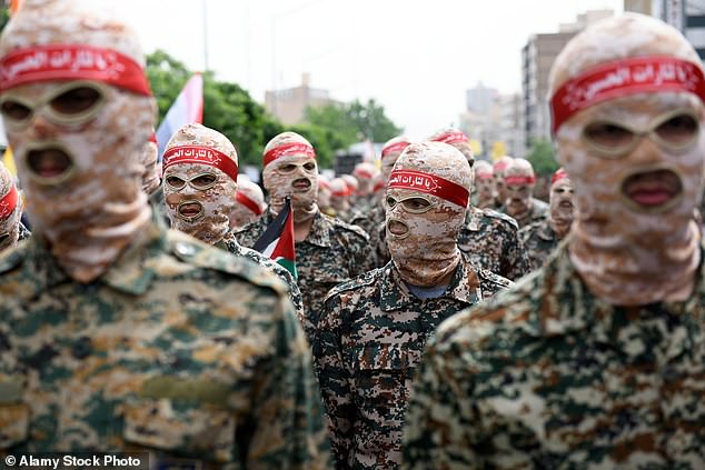 Members of the Islamic Revolutionary Guards Corps (IRGC) march during the annual pro-Palestinians Al-Quds, or Jerusalem, Day rally in Tehra.  April 29, 2022