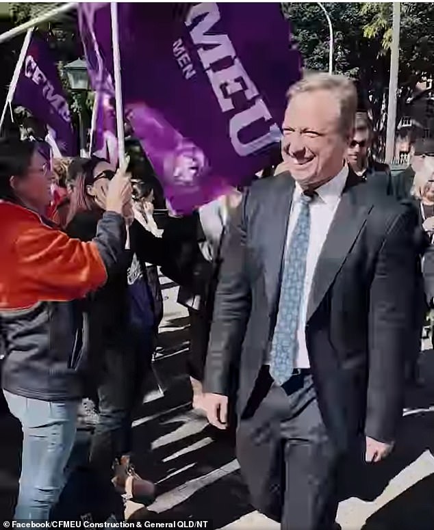 Prime Minister Steven Miles walked past demonstrators on his way to parliament to hand over the state budget