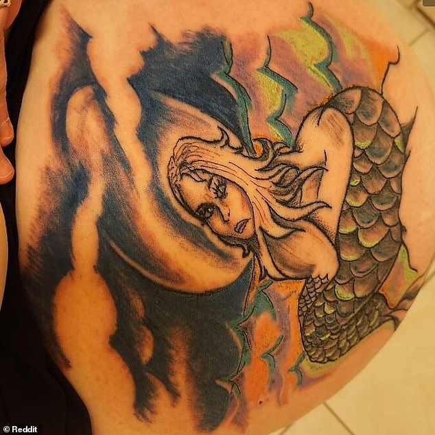 This questionable mermaid tattoo may leave your head confused as it is not clear what position she is in