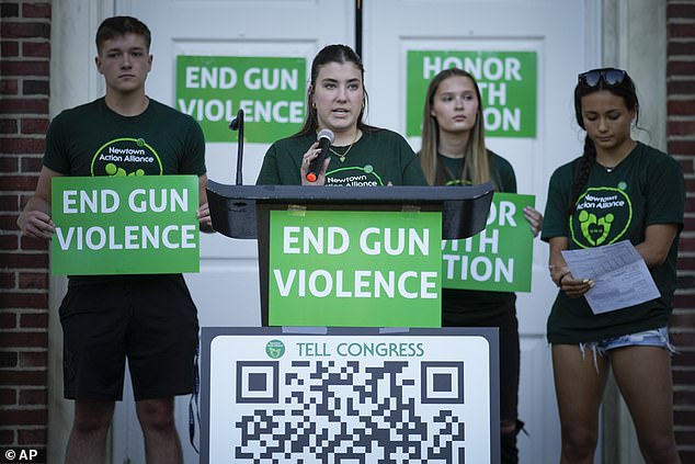 Emma Ehrens, center, a survivor of the 2012 Sandy Hook Elementary School shooting, speaks as she stood with other survivors at a rally against gun violence last week