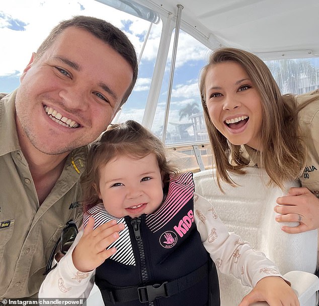 Bindi shares Grace with her American husband Chandler Powell (left), 27, who she married in 2020