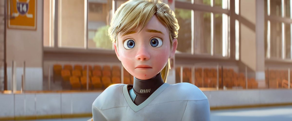 Inside Out's Riley, now 13 years old, stands on the ice of a rink in hockey gear and looks concerned in Pixar Animation Studio's Inside Out 2