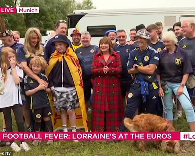 Along with other football supporters, Lorraine said: 'The atmosphere is really fantastic, but in Germany we're out of beer!'