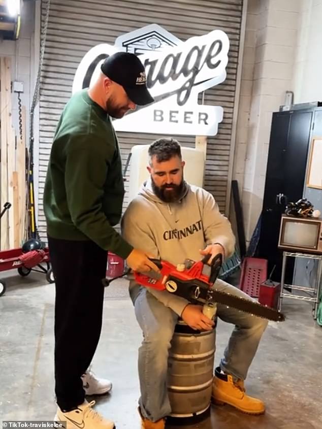 The tight end also grabbed a chainsaw and handed it to his brother so he could pose with it