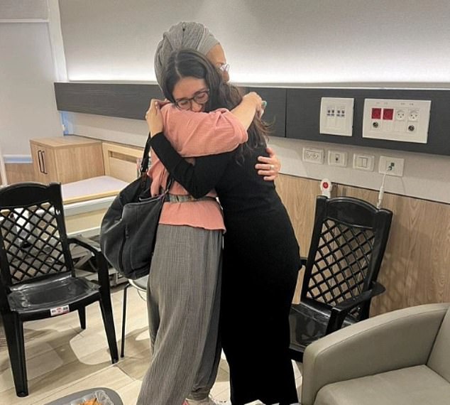 Noa Argamani, one of four Israeli hostages rescued from Gaza by the IDF on Saturday, is pictured hugging her boyfriend's mother.  The 26-year-old was pictured hugging Ditza Or, the mother of Avinatan Or, one of several people taken hostage by Hamas and taken to Gaza on October 7.