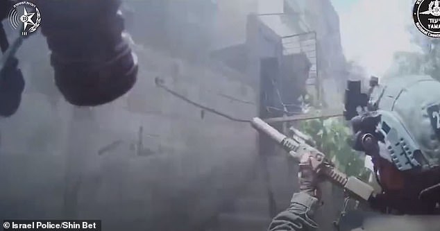 Special forces consisting of undercover Yamam and Shin Bet agents surround one of two heavily guarded buildings in Al Nuseirat, Gaza