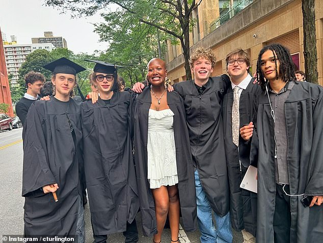 Finn and his friends in their black graduation gowns