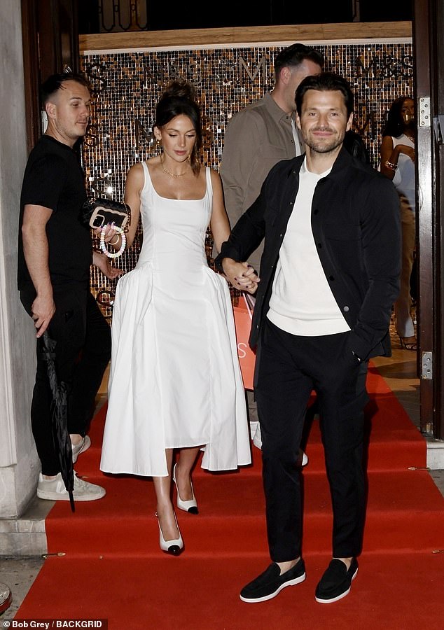 Mark and Michelle looked every bit a happy couple as they left the event