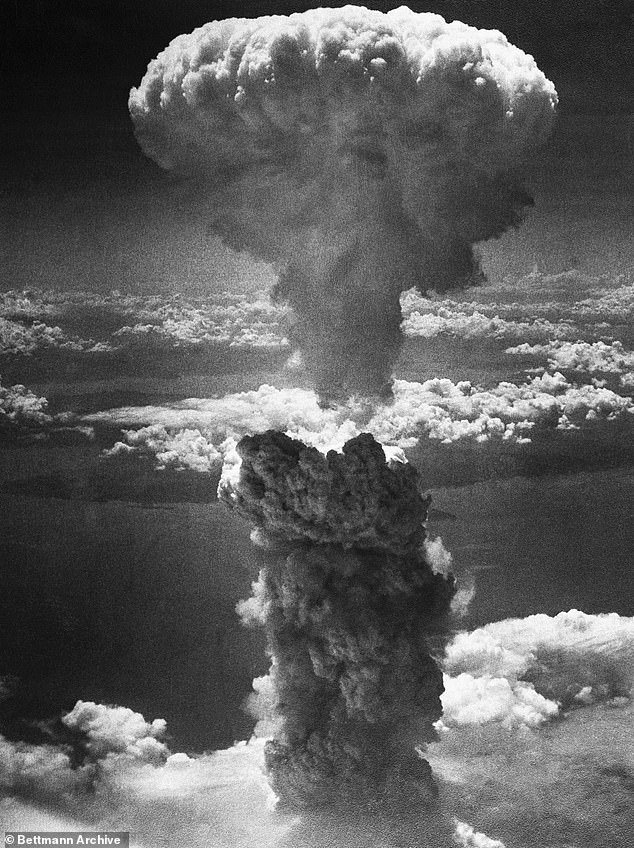 A mushroom cloud towers 20,000 feet over Nagasaki, Japan, after a second nuclear attack by the United States on August 9, 1945