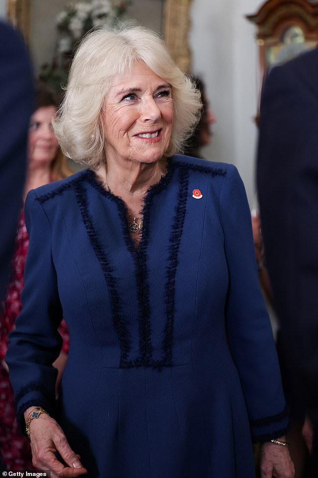 Camilla greets guests at Clarence House to celebrate the centenary of The Poppy Factory, which was founded to provide employment for soldiers injured in the First World War