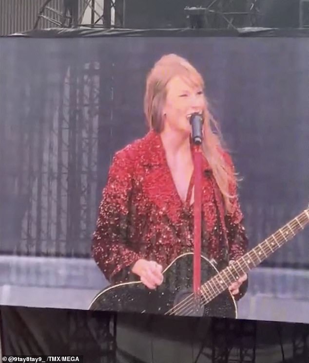 The pop icon, 34, dazzled in a shimmering red deep blazer, with a guitar in her hands