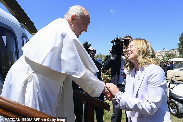 Meloni was also on hand to greet the Pope as he arrived at the summit by helicopter and landed in Savelletri