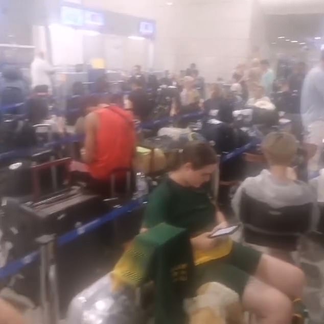 Another video shows hundreds of people waiting with their luggage at the airport for check-in