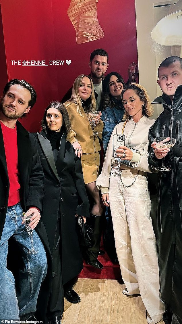 Jess (second from left) wore a beautiful oversized black overcoat, complete with a black turtleneck, black trousers and loafers