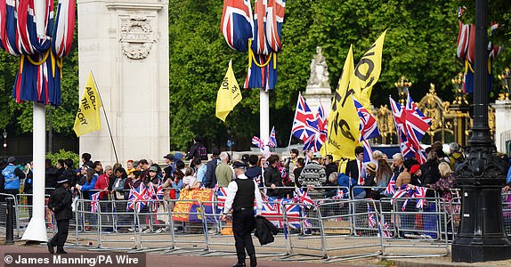 Protesters wave banners on The Mall ahead of the Trooping the Color ceremony during the Horse Guards Parade in central London, as King Charles III celebrates his official birthday.  Date of photo: Saturday, June 15, 2024. PA Photo.  See PA story ROYAL Trooping.  Photo credit should read: James Manning/PA Wire