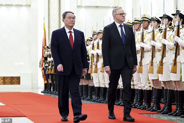 Prime Minister Anthony Albanese will host Chinese Premier Li Qiang for part of his trip (pictured shows the pair meeting in China late last year)