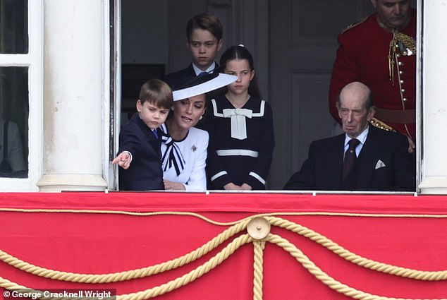 Prince Louis points at something during the Trooping the Color event