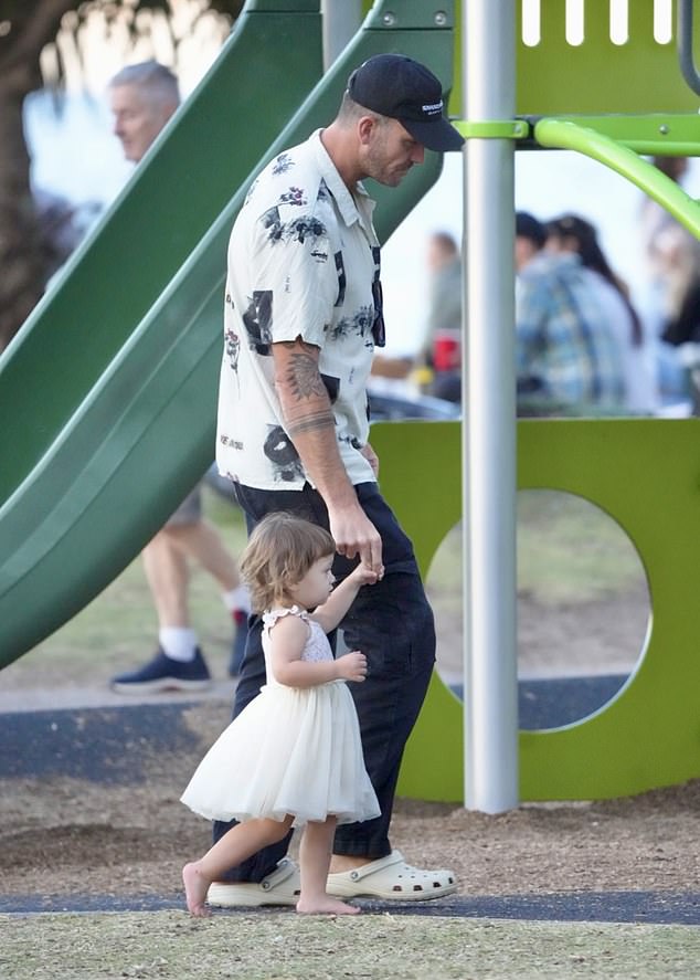 Matt played with his daughter who ran around barefoot