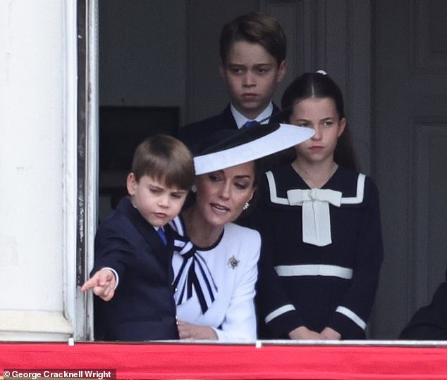 The Princess of Wales speaks to Prince Louis today as they watch Trooping the Colour