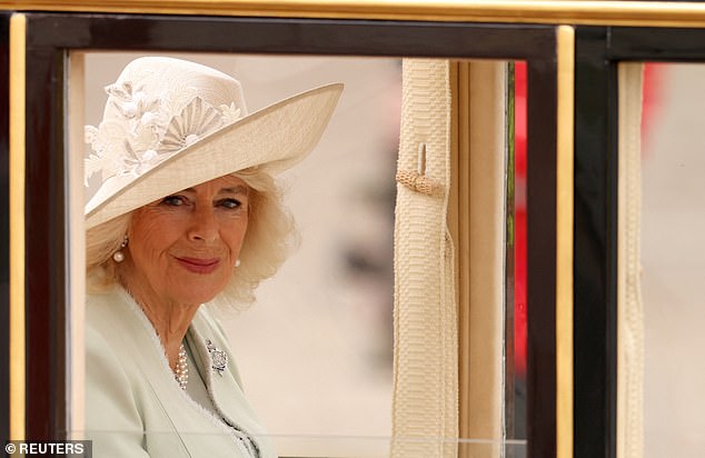 The Queen looked stunning in a light blue outfit and matching hat, while Kate looked cheerful in a matching white set