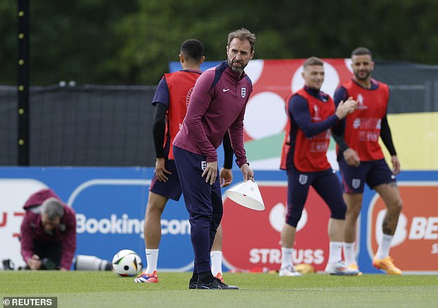 Three Lions manager Gareth Southgate watches as training exercises take place around him