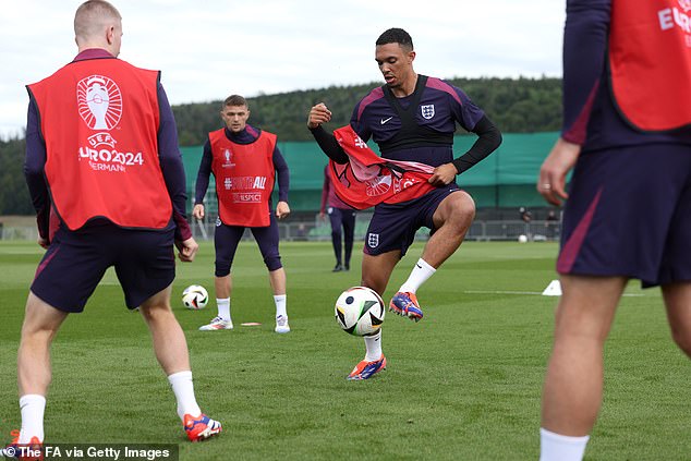 Alexander-Arnold struggles with a red bib while in the middle of a rabona workout