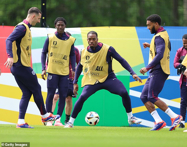 Man United midfielder Kobbie Mainoo (second from left) watches intently as Toney tries to win the ball back