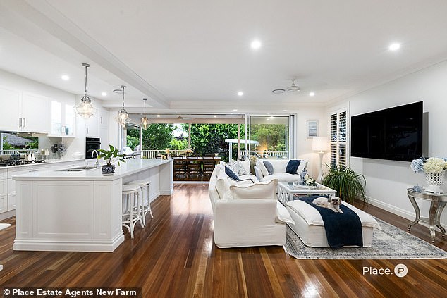 The home was designed in the popular 'Hamptons' holiday home style and built specifically for Ariarne's parents, Steve and Robyn.  In the photo: the beautiful kitchen with adjacent entertainment terrace